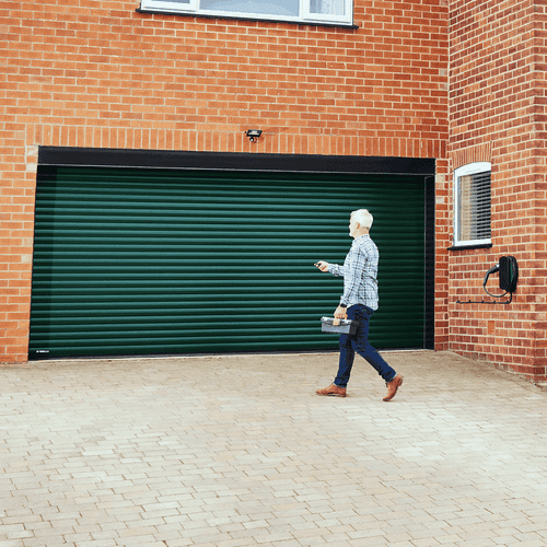 Close up of man opening Garolla Titan roller garage door